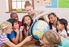 PISA Foreign Language - students with female teacher over globe 